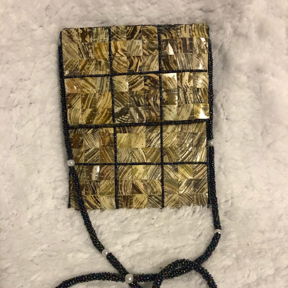 Small purse made out of shell squares